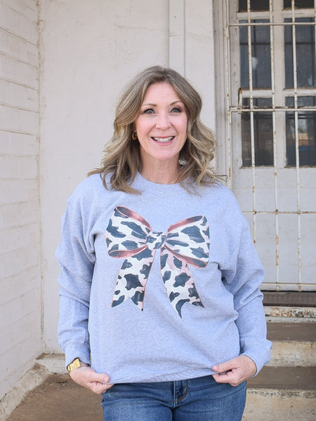 BIG ON BOWS COW PRINT SWEATSHIRT - REG/CURVY - Salty Lime Boutique