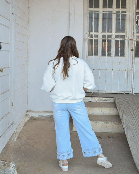 EMBROIDERED HEM WASHED STRETCH DENIM PANTS -  LT DENIM