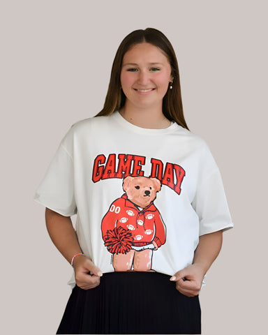 white t-shirt with a red bear graphic and 'GAME DAY' text on a plain background