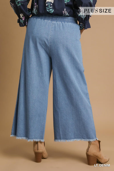WASHED DENIM PANTS WITH FRAYED HEM BY UMGEE - CURVY