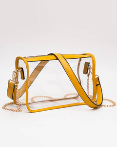 Yellow transparent handbag with gold chain strap on a white background